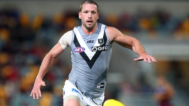 BRISBANE, AUSTRALIA - JULY 04: Travis Boak of the Power chases the ball during the round 5 AFL match between the Brisbane Lions and the Port Adelaide Power at The Gabba on July 04, 2020 in Brisbane, Australia. (Photo by Jono Searle/AFL Photos/via Getty Images )