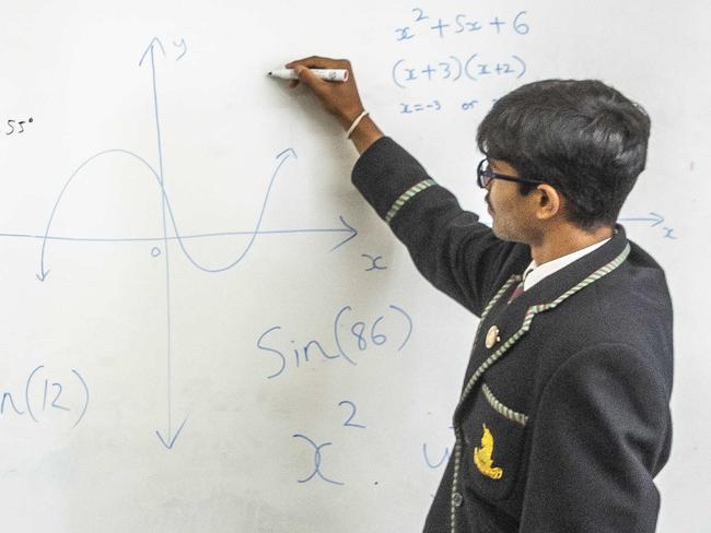 National education story - Maths and STEMMelbourne High Principal Anthony Mordini is joined by students Sandush Peiris (15), Louis Rainsford (15), Gabriel Tran (16) and Shannon Rs (15). Picture: Jake Nowakowski. Picture: Jake Nowakowski