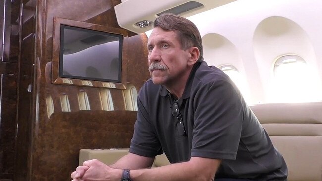 Russian convicted arms dealer Viktor Bout is seen on a plane ahead of departing for Russia. Bout, nicknamed the 'Merchant of Death,' was released to Russia in a swap for the US basketball star on Thursday.