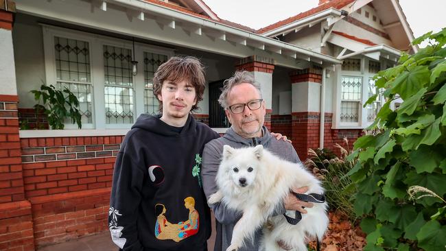 David Leggatt with his son Ben 19yrs and dog Cookie outside their home in Victoria. Picture: Ian Currie