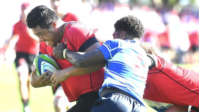 Terrace prop Ezekiel Amituanai drives through the tackle of Nudgee’s Lastus Auakai. Picture: AAP image/John Gass