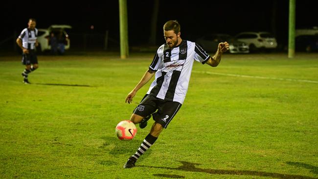 Scott McEwan kicks the ball long for Bingera.