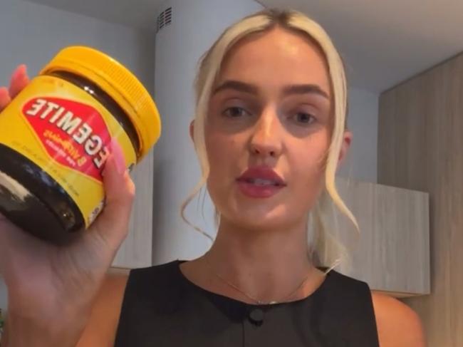 Morgan Riddle on her Instagram live attempting to eat a jar of vegemite