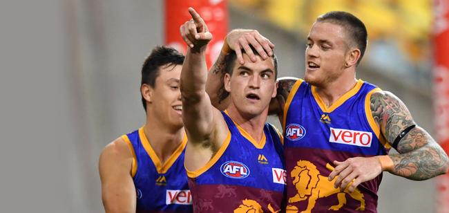 Tom Rockliff celebrates a goal with Claye Beams, right, last year. Picture: AAP Image