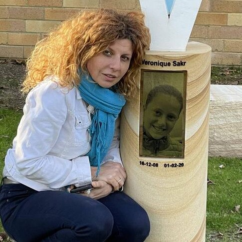 Bridget Sakr with a memorial to her daughter Veronique Sakr, who was tragically killed in the Oatlands crash along with three of her cousins.