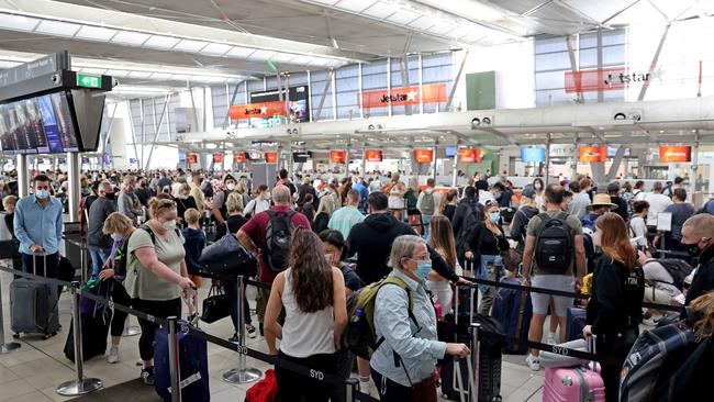 Frustrated travellers were left queuing for hours in lines that snaked around the foyer and outside. Picture: NCA NewsWire / Damian Shaw