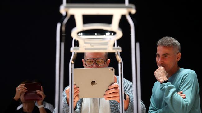 Apple chief design officer Jony Ive (L) uses an iPad. Picture: Getty