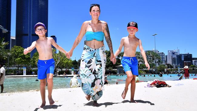 Brock, Natalie and Ronan Sinclair are visiting the Sunshine state from Sydney. Picture: John Gass