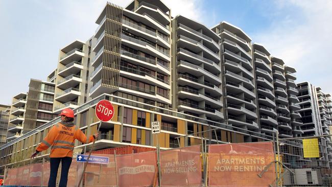 There is something terribly wrong when unionised lollipop workers can earn close to $180,000 a year on regional construction projects for holding up a sign when a teacher with seven years’ experience gets half that, writes Des Houghton. Picture: AFP PHOTO / WILLIAM WEST.