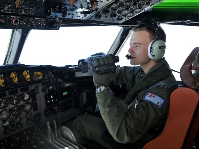 A Royal Australian Air Force AP-3C Orion searches for missing flight MH370. Picture: Pilot Russell Adams searched