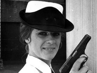 04/1971. Police woman Lee Barker at pistol practice. Female. Women. Guns. Police uniforms. Hats. 1970s. Victoria Police. Melbourne. Neg: DD07022