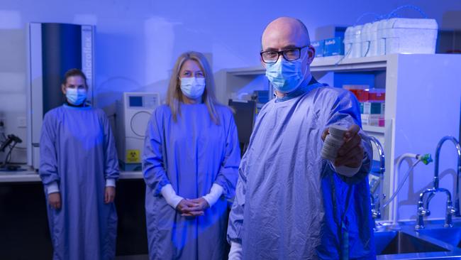 Head of clinical research unit at the Alfred Hospital in Melbourne, James McMahon, clinical research co-ordinator Michelle Hagenauer, centre, and Jessica Wisniewski, lab project manager, in August during a new clinical trial of the flu treatment Favipiravir, which might help COVID patients. Picture: Wayne Taylor