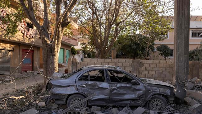 A car destroyed in an Israeli airstrike sits surrounded by debris in the ancient city of Baalbek, home to the Roman temples. Picture: AFP