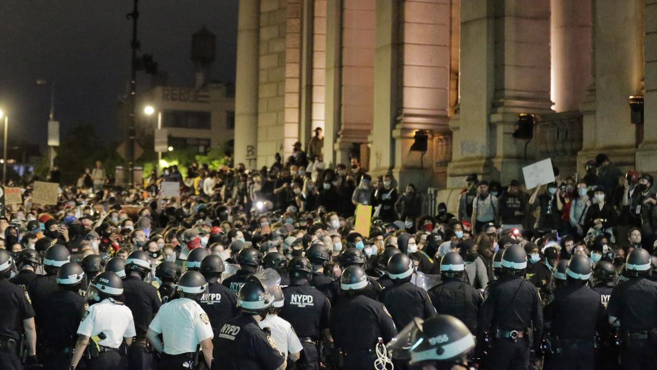 Police block protesters from exiting the Manhattan Bridge in New York. Picture: AP/Seth Wenig