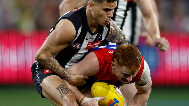 Bobby Hill wraps up Jake Bowey. Picture: Michael Willson/AFL Photos via Getty Images