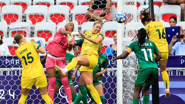 Hayley Raso heads home the Matildas’ second goal. (Photo by Valery HACHE / AFP)