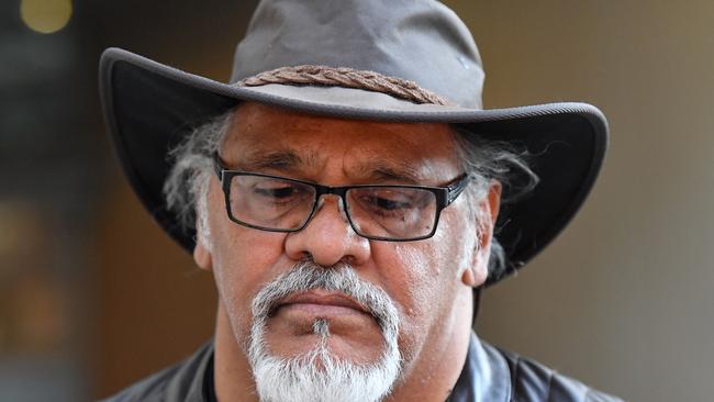 Adrian Burragubba from the Wangan and Jagalingou traditional ownersoutside the Federal Court in Brisbane. Picture: AAP/Darren England<br />