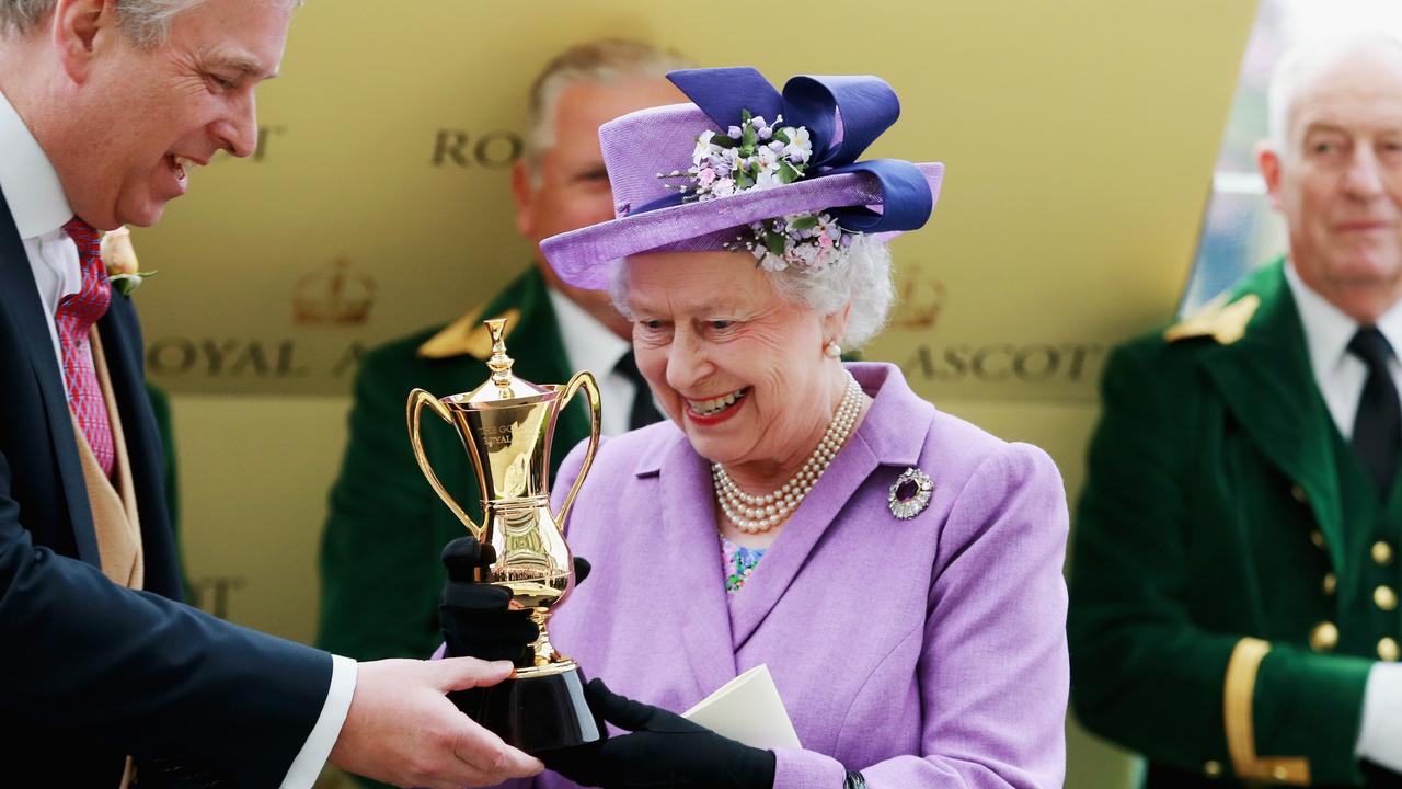 Queen Elizabeth II holds the Gold Cup with Prince Andrew after Ryan Moore riding Estimate won The Gold Cup during Ladies' Day on day three of Royal Ascot on June 20, 2013. Picture: Chris Jackson/Getty Images for Ascot Racecourse.