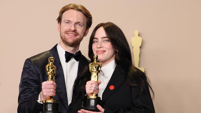 Finneas O'Connell and Billie Eilish, winners of Best Original Song award for What Was I Made For? from Barbie, proudly hold their winning statues. Picture: Getty Images