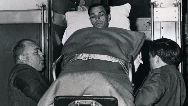 Champion golfer Ben Hogan is lifted from a train which brought him to his home town to recuperate from a near fatal auto accident. He was hospitalised in early February, 1949.