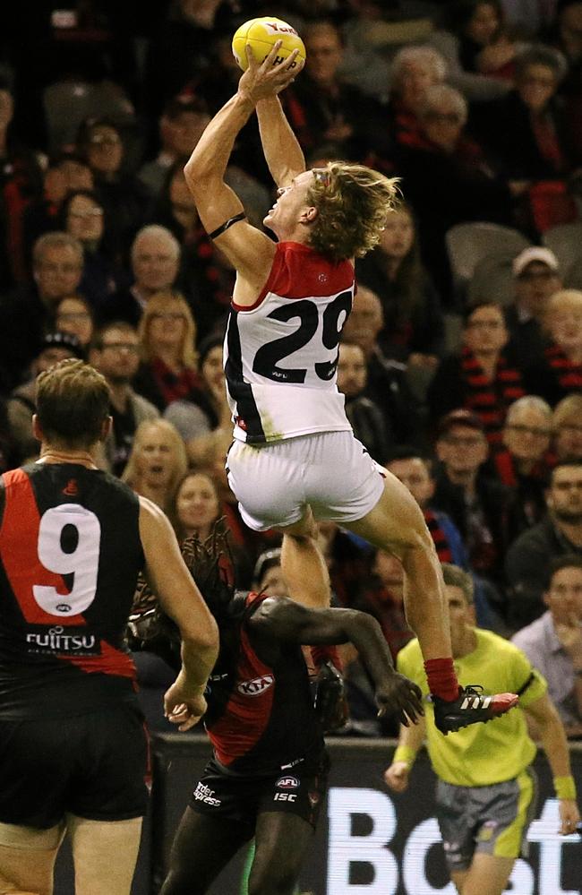 Melbourne’s Jayden Hunt flies over Anthony McDonald -Tipungwuti. Picture: Wayne Ludbey