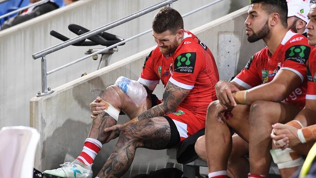 Dragons player Josh Dugan grimaces after sustaining an injury during the Round 17 NRL match between the Gold Coast Titans and the St George Dragons at Robina Stadium on the Gold Coast, Friday, June 30, 2017. (AAP Image/Dave Hunt) NO ARCHIVING, EDITORIAL USE ONLY