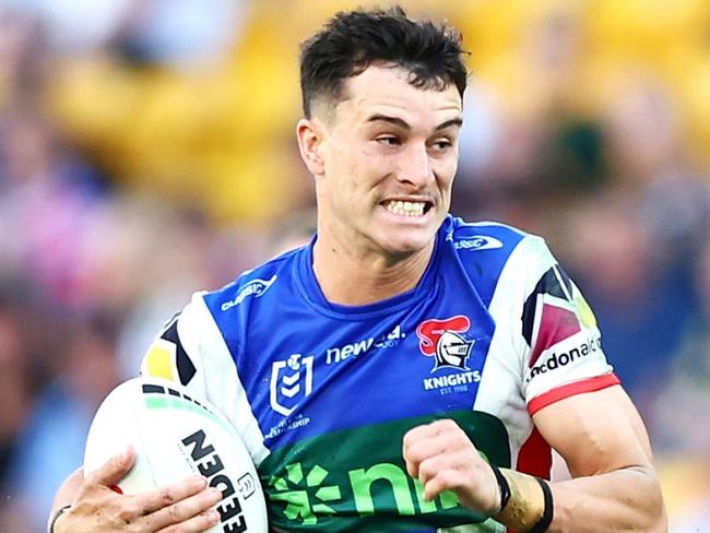 BRISBANE, AUSTRALIA - MAY 18: David Armstrong of the Knights breaks a way to score a try during the round 11 NRL match between Gold Coast Titans and Newcastle Knights at Suncorp Stadium, on May 18, 2024, in Brisbane, Australia. (Photo by Chris Hyde/Chris Hyde)