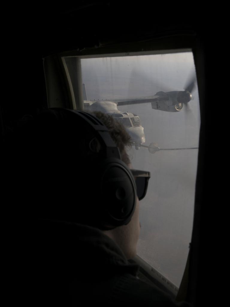 U.S. Marine Corps Lance Cpl. Braydon Longhurst, a loadmaster with Marine Aerial Refueler Transport Squadron (VMGR) 152, observes an inflight refueling between his aircraft and an MV-22B Osprey with Marine Medium Tiltrotor Squadron 363 refuel in support of Exercise Talisman Sabre 21, Australia, July 13, 2021. TS21 is AustraliaÃ¢â&#130;¬â&#132;¢s largest military exercise with the U.S. and is a demonstration of our strong alliance underpinned by deep levels of cooperation and trust built over decades of operating and training together. (U.S. Marine Corps photo by Cpl. Bryant Rodriguez)