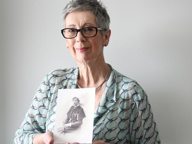 ‘A great way to keep the story alive’ ... Maggie Johnson holds an image of her grandmother, AnzacLive character Alice Ross-King.