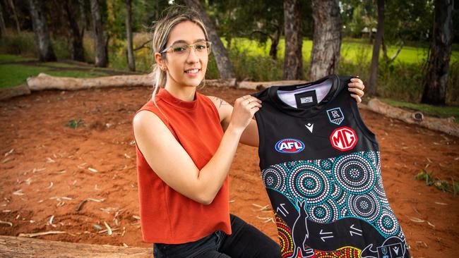 Aboriginal artist Elle Campbell with the relaunched Port Adelaide Indigenous jumper. Picture: Tom Huntley