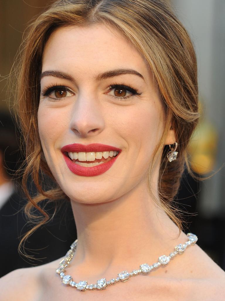 Sadly Anne Hathaway’s jewells outshone her 2011 turn as Oscars host. The award-winning actress arrives wearing a necklace and earring set worth around $US 10 million made by Tiffany Co. Picture: Getty