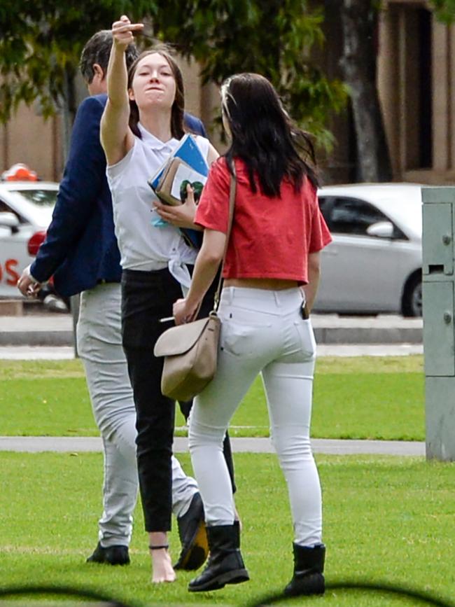 Darcie Ranger and Jessica Glaser leave the District Court with a supporter.