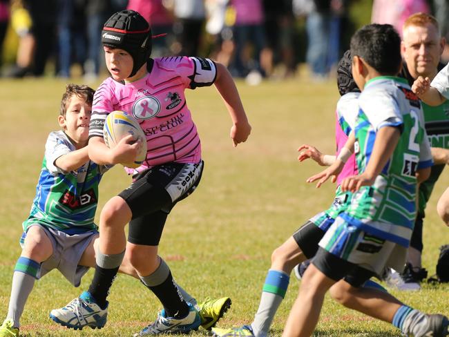 Heath Stafford of the Rhinos on the charge against Parramatta in their under-9s game.