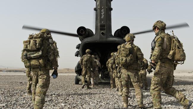 Australian Army soldiers from Special Operations Task Group and their Afghan National Security Force partners board a US Army CH-47 Chinook helicopter at Multi-National Base Tarin Kowt, Uruzgan province, southern Afghanistan, in 2012.