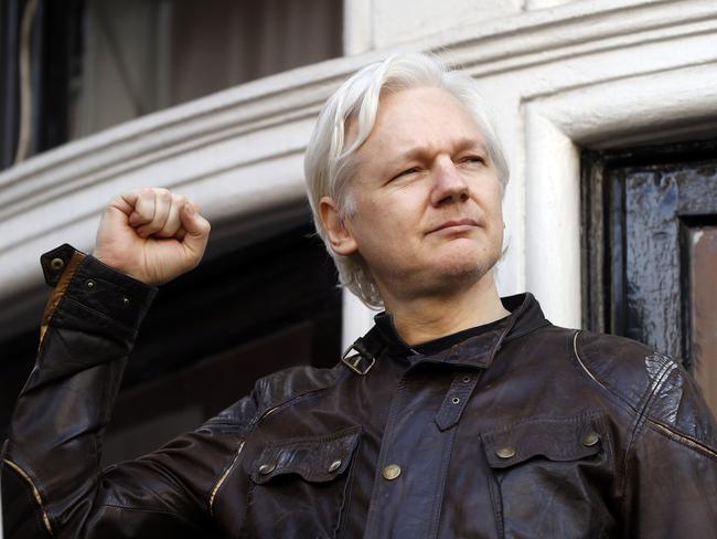 WikiLeaks founder Julian Assange greets supporters in May last year outside the Ecuadorean embassy in London. Picture: AP