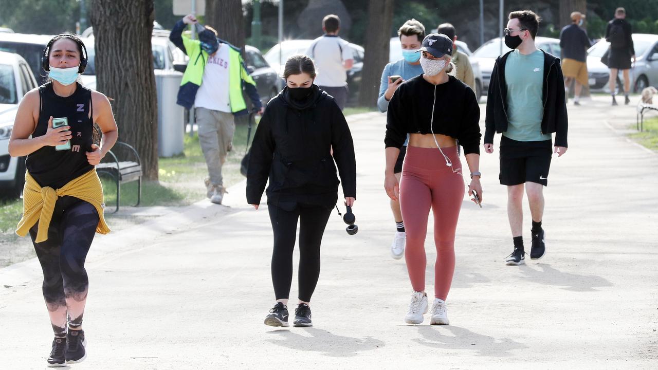 People wearing masks during the COVID-19 lockdown in Melbourne. Picture: David Crosling/NCA NewsWire