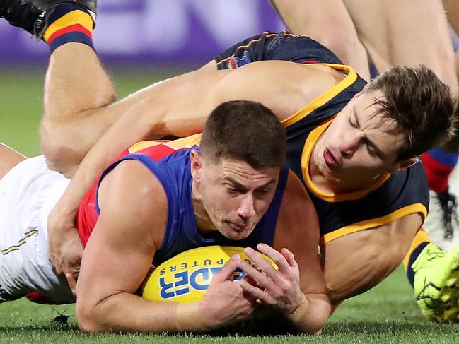 Crow Jake Kelly wraps up Brisbane star Dayne Zorko. Picture: AFL Photos/Getty Images