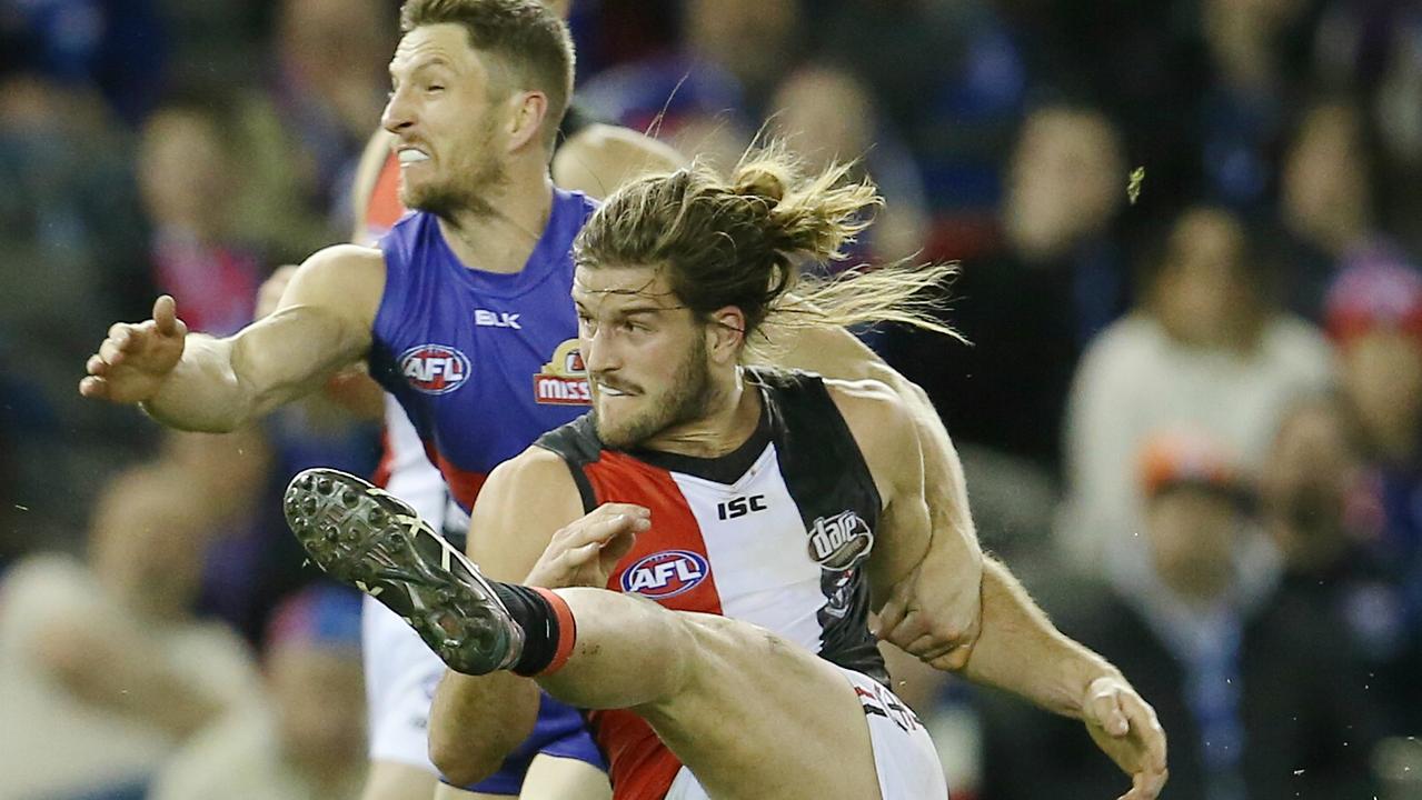 Josh Bruce gets a kick away against his new club in 2016.