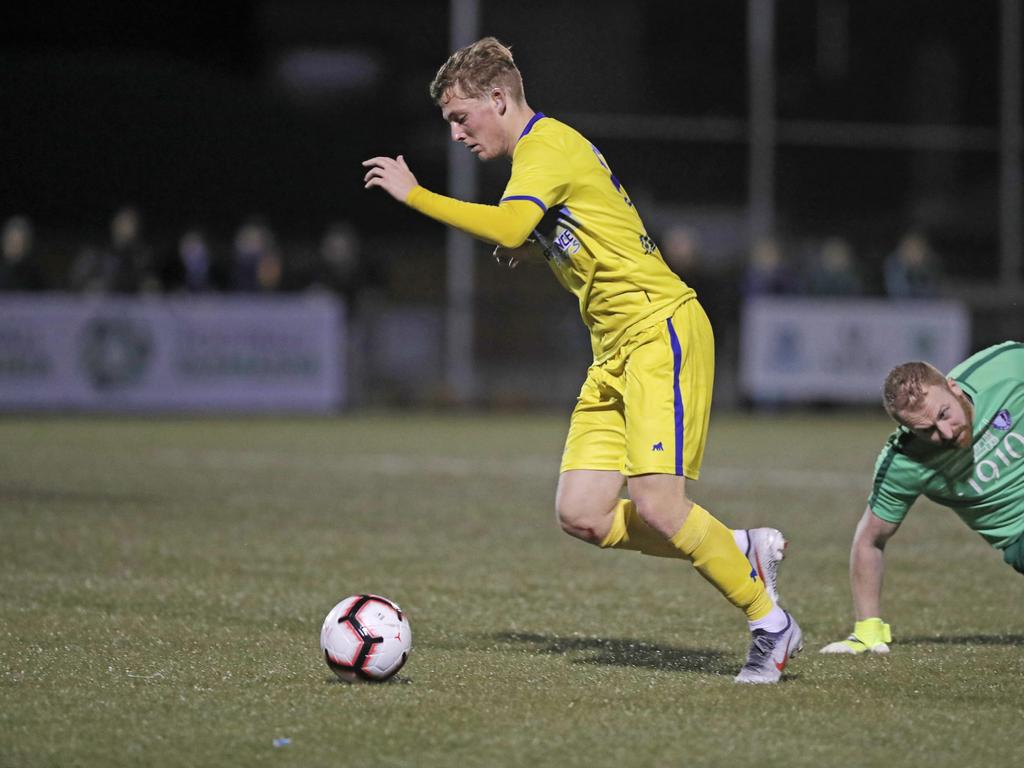 Lokoseljac Cup Final at KGV. Devonport Strikers versus South Hobart. Devonport's Max Fitzgerald beats South Hobart goal keeper Graham Wright. Picture: PATRICK GEE