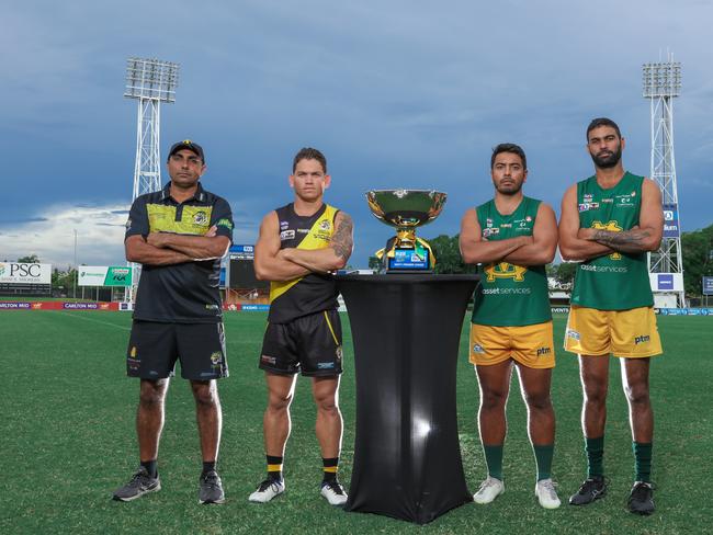 Nightcliff coach Chris Baksh with captain Phillip Wills, and St Mary’s co-captains Shannon Rioli and Raph Clarke alongside the 2020-21 NTFL Premiership Cup. Picture: Glenn Campbell