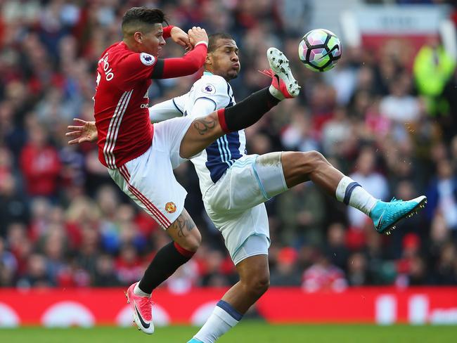 United’s Marcos Rojo and Jose Salomon Rondon of West Brom battle for possession.