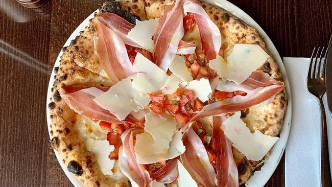 Anything better than Beccofino's pizza with mozzarella, fresh tomato, finely diced onion, basil, speck and shavings of parmigiano. Picture: Facebook/@beccofinopizzeria