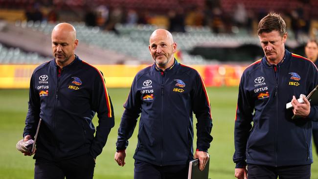 Crows coach Matthew Nicks, football manager Adam Kelly and assistant Ben Hart leave the field on Wednesday night. Picture: Daniel Kalisz/Getty Images