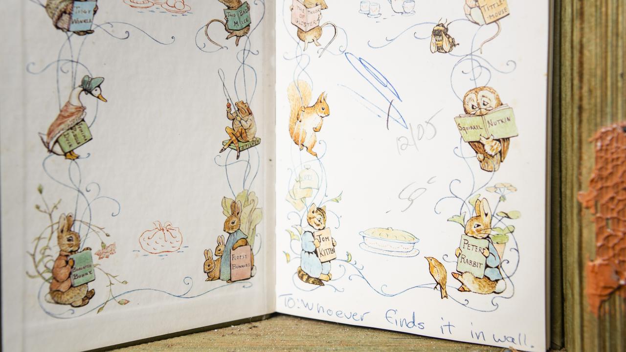 Andrew Fletcher found a Beatrix Potter book with a message written in it in a wall while renovating his Toowoomba home. Picture: Kevin Farmer