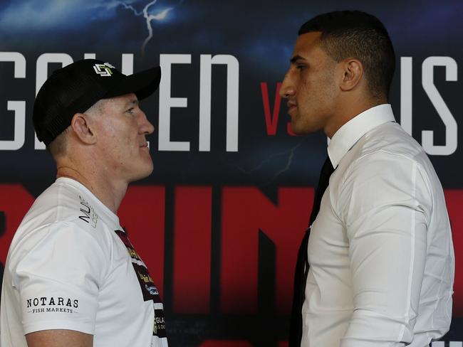 Paul Gallen and Justis Huni face off after a press conference at the Aware Super Theatre in Sydney.