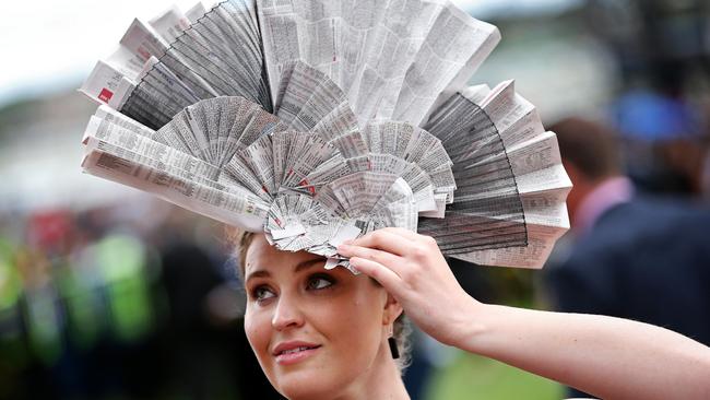 The Mad Hatters category is a chance to create headwear out of materials you have at home — like this newspaper hat worn by Elizabeth Lewis on Derby Day in 2014. Picture: Mark Stewart