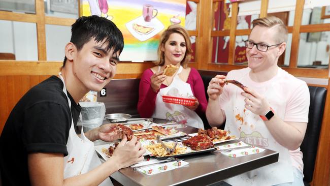 Zack Pham, Harsha Paryana and Brant Fahey eating at Ribbett's Restaurant which has been an institution in Dutton Park for 40 years. Picture: Tara Croser