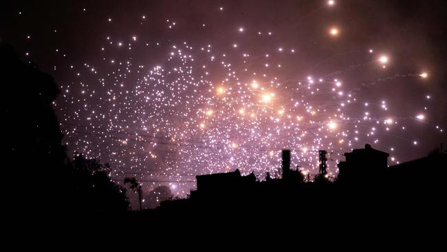 Sparks fly at the site of an Israeli airstrike on the outskirts of the southern Lebanese village of Zawtar.