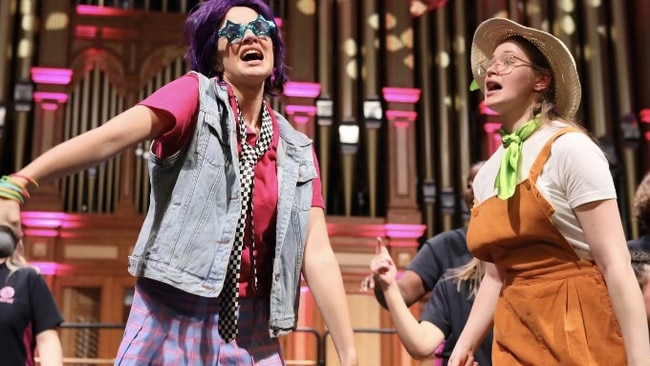 Brooke, right, is pictured here doing a musical medley for the Australian Girls Choir, performing Vivo alongside Annabelle Williams. Picture: Supplied