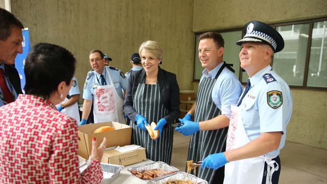 Tanya Plibersek MP, Ben Fordham and Police Commissioner Mick Fuller, helping out at Surry Hills Police Community BBQ. Picture: Tim Hunter.